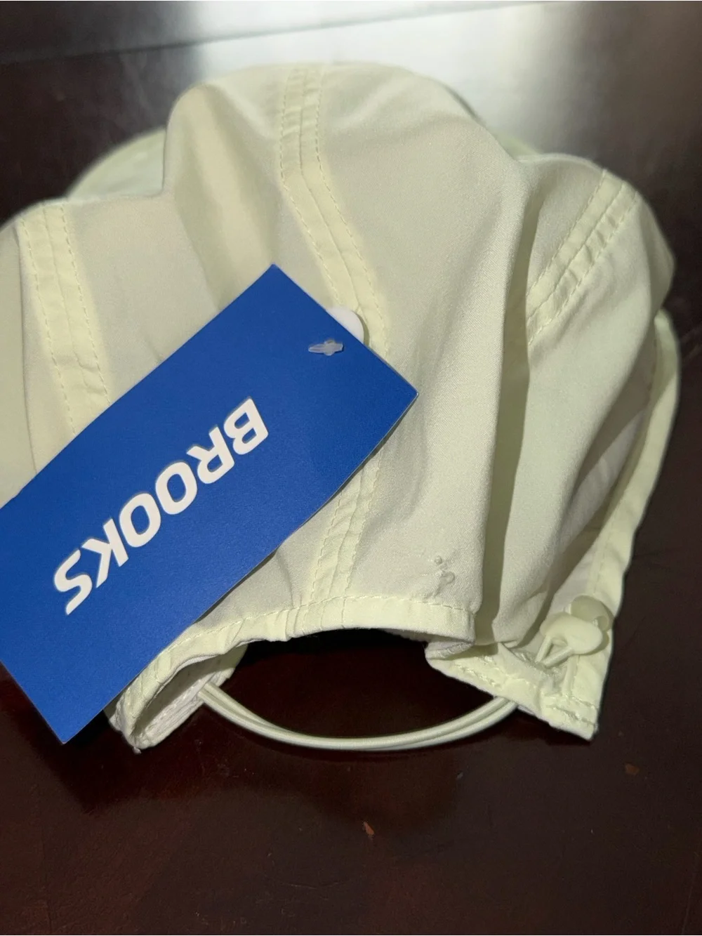 Brooks Light Cream Performance Cap with Navy Logo